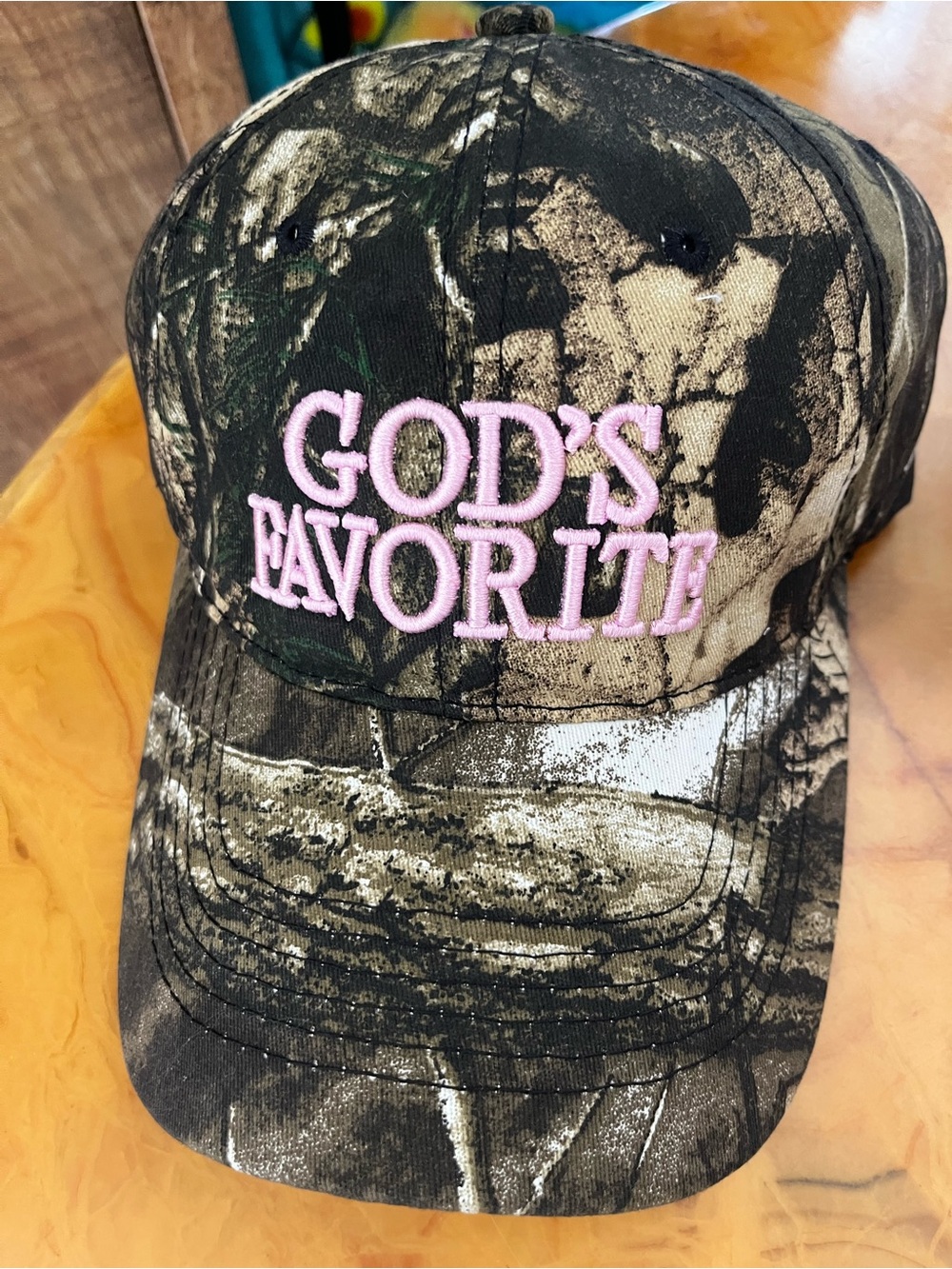 New Gods Favorite Baseball Cap Camo with pink embroidered words